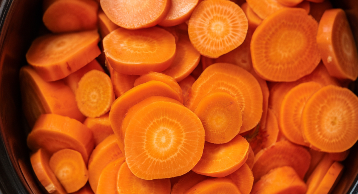 Put raw sliced carrots in a slow cooker with these 3 ingredients. It’s the perfect winter side.
