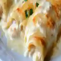 Chicken enchiladas with sour cream white sauce