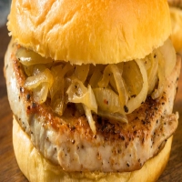 Savory pork chop sandwich with sweet applesauce