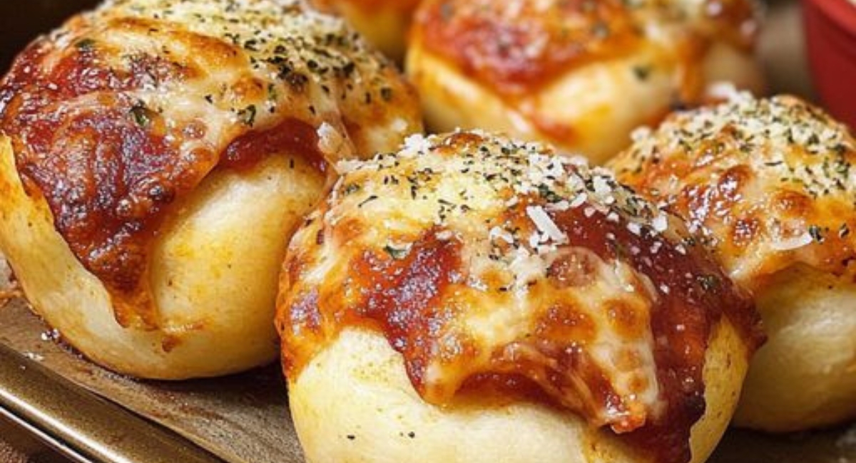 Flavorful pizza bombs, brushed with garlic butter and topped with Parmesan.